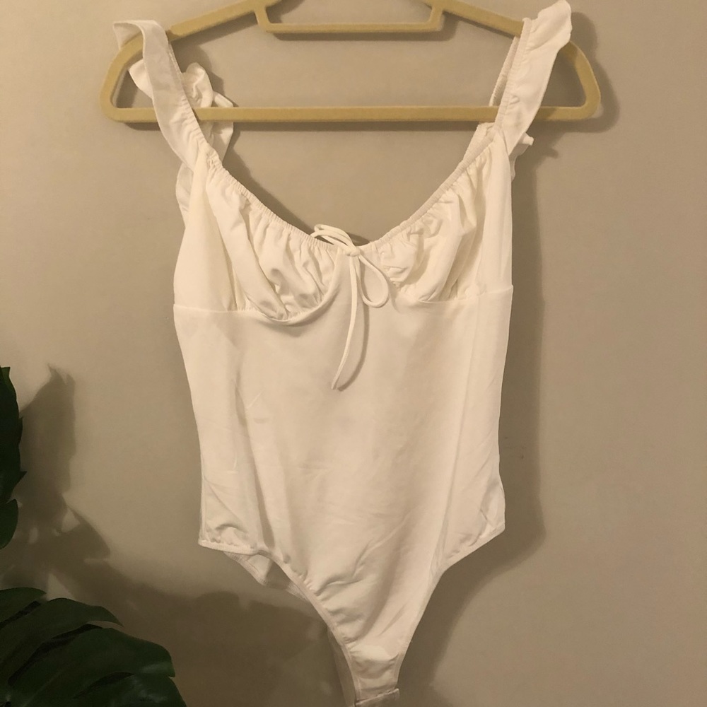 Flirty white tank bodysuit